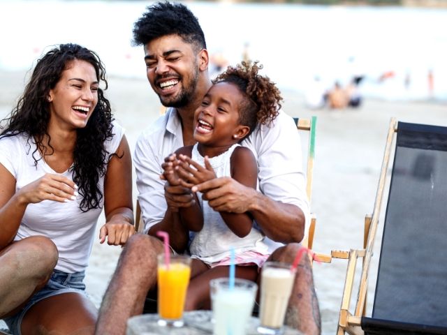 Tax Season Preparing know your filing status. A top tax tip with happy family on the beach.