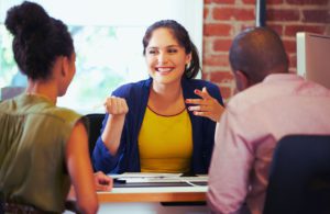 Couple Meeting with Lady in the office to discuss taxes