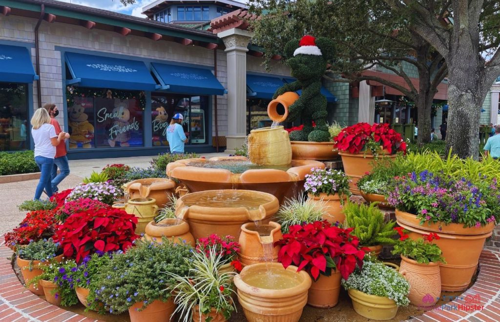 Mickey Mouse Fountain in Disney Springs with Christmas Decorations. Keep reading to learn how to budget for the holidays and for Christmas.