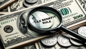 Close-up of a stack of dollar bills with a magnifying glass on top, symbolizing the tax benefit rule and the importance of scrutinizing financial transactions for tax advantages.